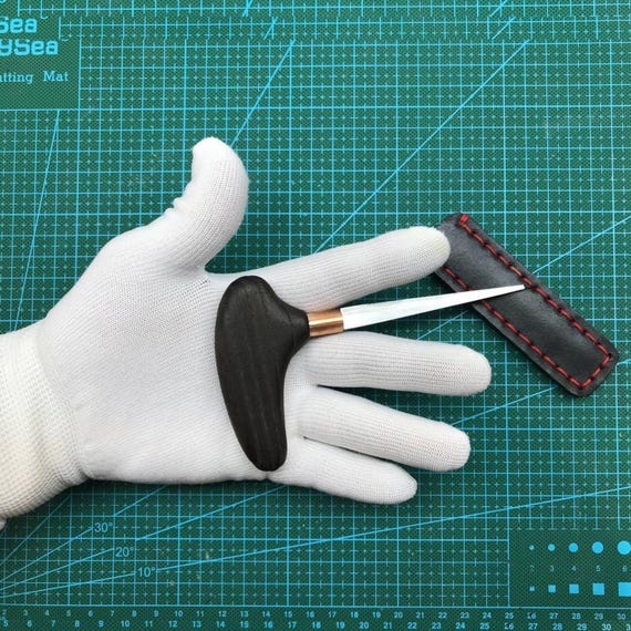 Hand-forged 18th-century-style sewing awl that doubles as a leather craft and wood carving EDC tool — genuinely rare functional blacksmithing.