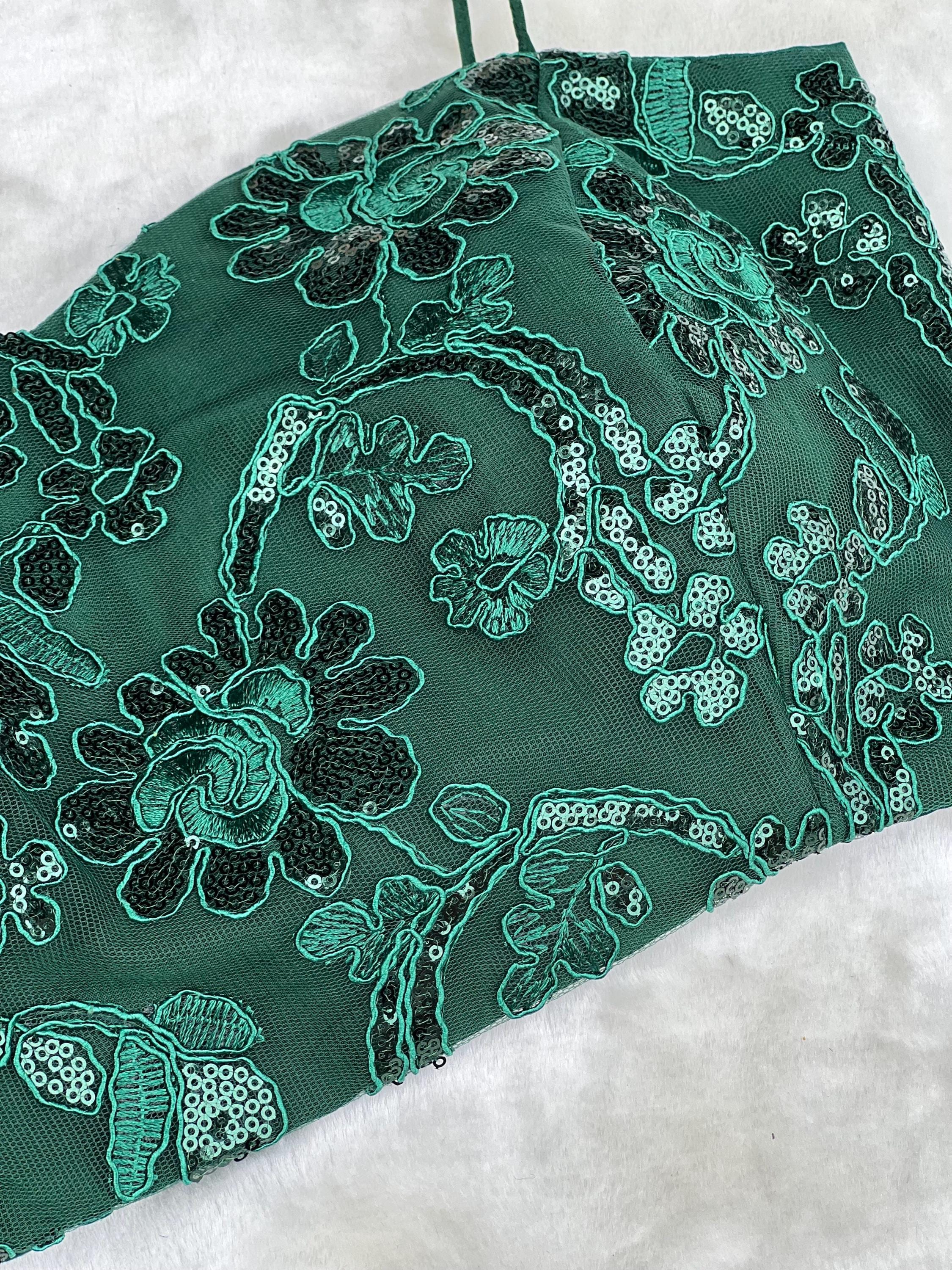 Green draped saree with haulter neck blouse