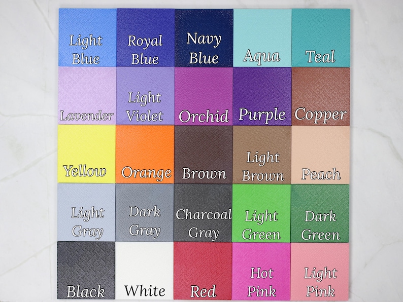 May include: A color chart featuring 25 squares in various shades. The squares are labeled with color names such as "Light Blue," "Royal Blue," "Navy Blue," "Aqua," and "Teal." Other colors include "Lavender," "Orchid," "Purple," "Yellow," "Orange," and "Brown."