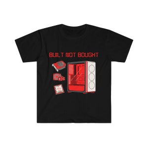 May include: Black t-shirt with a red and white graphic of computer components, including a PC case and a graphics card. The text "BUILT NOT BOUGHT" is printed in red above the graphic. A great gift for computer enthusiasts.