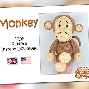 May include: A crocheted monkey amigurumi toy pattern in PDF format. The pattern is available for instant download. The monkey is brown with a cream-coloured face and a long tail. The pattern is available in both UK and US English.