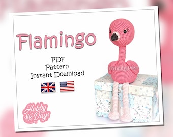 May include: A pink crocheted flamingo amigurumi toy sitting on a box with a floral pattern. The toy has black eyes and a black beak. The image includes the text "Flamingo PDF Pattern Instant Download" and the text "Hobby Days".