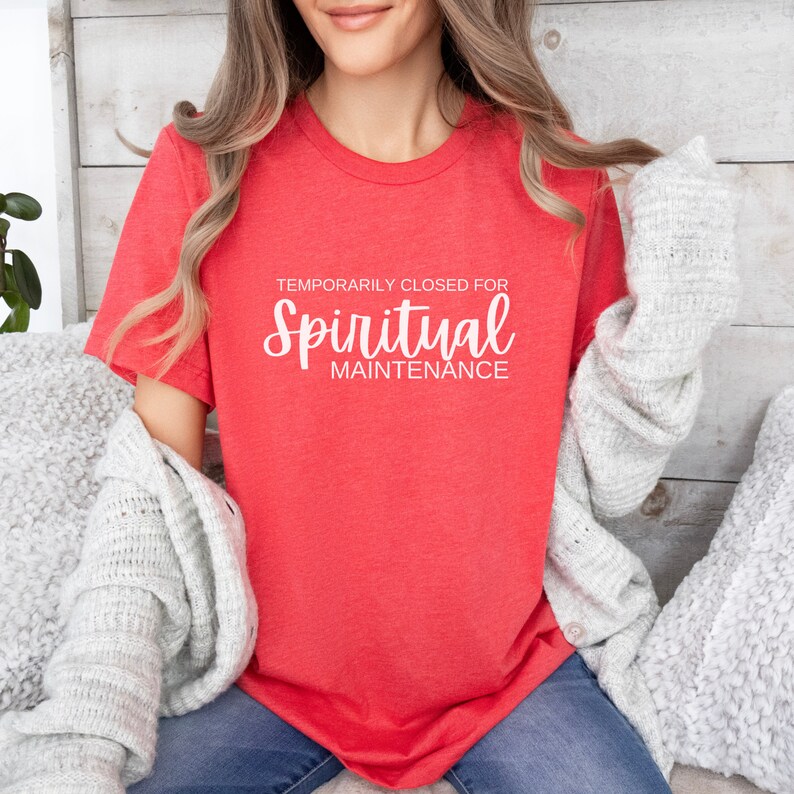 May include: A red t-shirt with the text "Temporarily Closed for Spiritual Maintenance" in white.