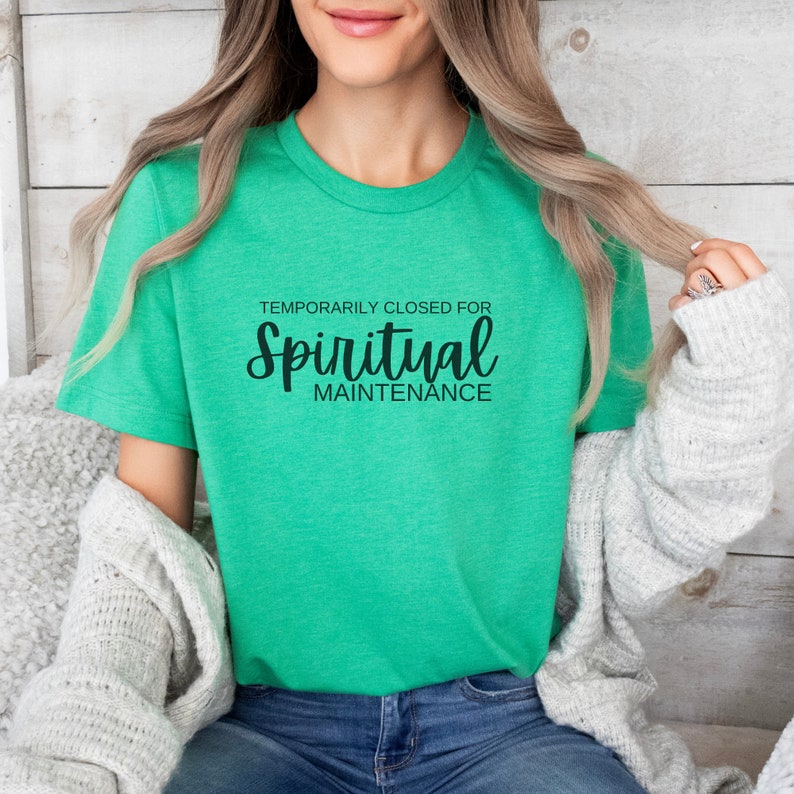 May include: A green t-shirt with the text "Temporarily Closed for Spiritual Maintenance" in black.