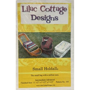 May include: A pattern for a small bag called a "Holdalle" with a finished size of 11 1/2 inches by 5 1/2 inches by 5 1/2 inches. The pattern is for an intermediate to advanced skill level and is from Lilac Cottage Designs.