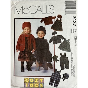 May include: McCall's sewing pattern for children's clothing, pattern number 2437, titled "Cozy Togs", featuring a girl and boy wearing different outfits, including a red jacket, a black jacket, a plaid overall, and a green dress.