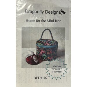 May include: A sewing pattern for a mini iron holder. The pattern is called "Home for the Mini Iron" and is from Dragonfly Designs. The pattern includes a sewing tip sheet and is numbered DFD#107.