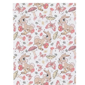 May include: A repeating pattern featuring a cartoon rabbit holding a pink flower, surrounded by pink butterflies, mushrooms, and floral accents. The design is set against a white background with small star-like details.