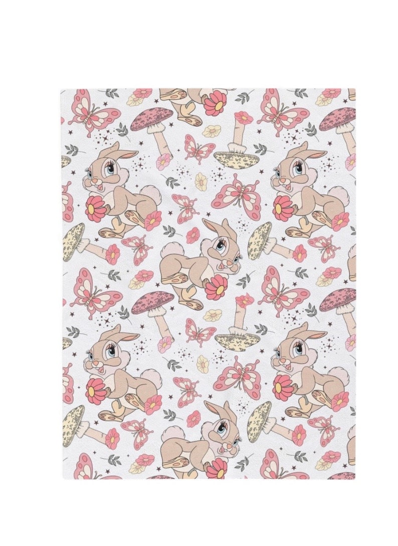 May include: A repeating pattern featuring a cartoon rabbit holding a pink flower, surrounded by pink butterflies, mushrooms, and floral accents. The design is set against a white background with small star-like details.