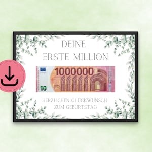 Op de afbeelding: Een ingelijste print met de tekst "DEINE ERSTE MILLION" en "HERZLICHEN GLÜCKWUNSCH ZUM GEBURTSTAG". De print toont een eurobiljet met een waarde van 1.000.000. Decoratieve groene bladeren omringen de tekst en het biljet.