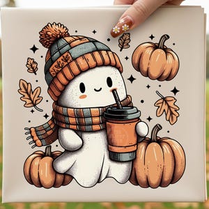 May include: A cute cartoon ghost wearing a knit hat and scarf, holding a coffee cup, and surrounded by pumpkins and fall leaves. The ghost is white with a smiling face. The hat and scarf are orange, gray, and brown. The pumpkins are orange.