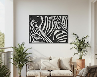 Puede incluir: Arte de pared de metal en blanco y negro que presenta un primer plano de dos caras de cebra. La obra de arte está recortada, creando un efecto de espacio negativo con las rayas de la cebra. La pieza es rectangular y está montada en una pared blanca.