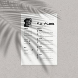 May include: A resume template with the name "Mari Adams" at the top. The resume includes sections for summary, experience, education, and skills. The document is printed on textured paper, with a shadow of a palm leaf overlaying the top left corner.