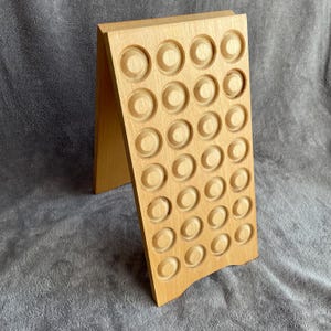 Champagne bottle cap display with grape clusters