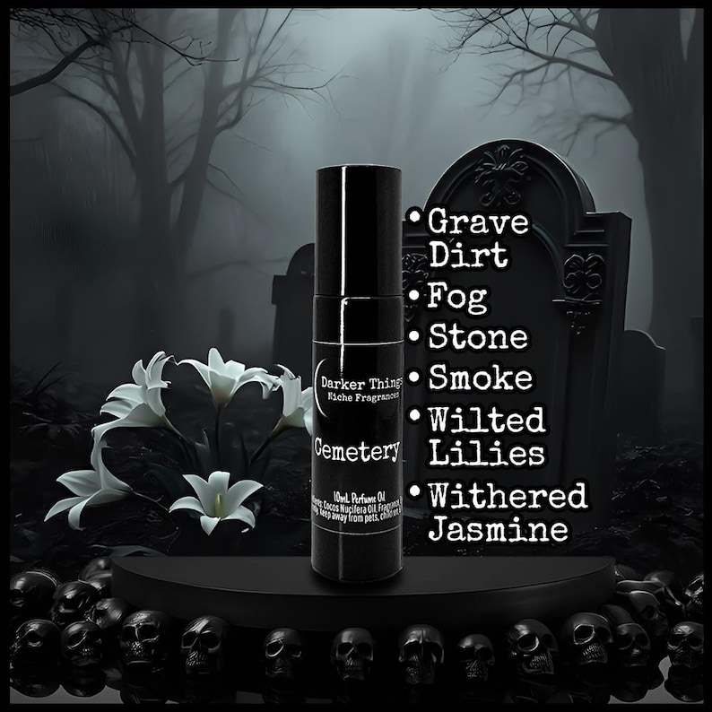 May include: A black perfume bottle with the name "Cemetery" against a gothic backdrop. The image includes a tombstone, white lilies, and skulls. Scent notes are Grave, Dirt, Fog, Stone, Smoke, Wilted Lilies, and Withered Jasmine.