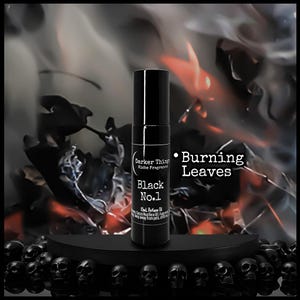 May include: A black perfume bottle labeled "Black No.1" with the text "Burning Leaves." The bottle is set against a backdrop of dark leaves and smoke, with a base of black skulls.