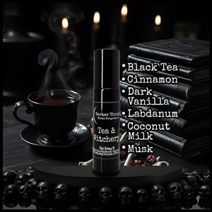 May include: A black 10ml perfume oil roller bottle labeled Darker Things Niche Fragrances Tea & Witchery. The label lists ingredients including Black Tea, Cinnamon, Dark Vanilla, Labdanum, Coconut Milk, and Musk. The bottle is cylindrical.
