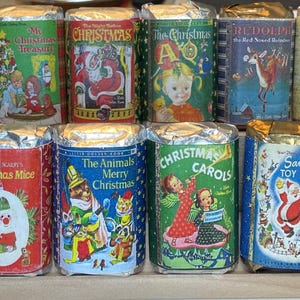 May include: A collection of ten vintage Christmas books with colorful illustrations and titles such as "Frosty the Snowman", "Christmas Mice", "The Animals Merry Christmas", "Christmas Carols", "Santa's Toy Shop", and "My Christmas Book".