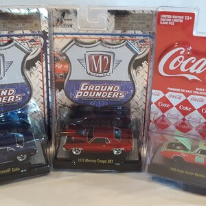 Set of 3 * M2 Machines 1:64 scale Dodge Plymouth and Mercury 1/64 scale diecast cars * New in package * Collectible
