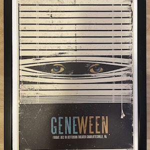 May include: A vintage-style concert poster for Gene Ween, featuring a pair of eyes peeking out from behind a set of blinds. The poster is in shades of blue, brown, and white, with the text "Gene Ween" in a bold, stylized font. The date and location of the concert are listed below the band name: "Friday, Dec 10 Jefferson Theater Charlottesville, VA."