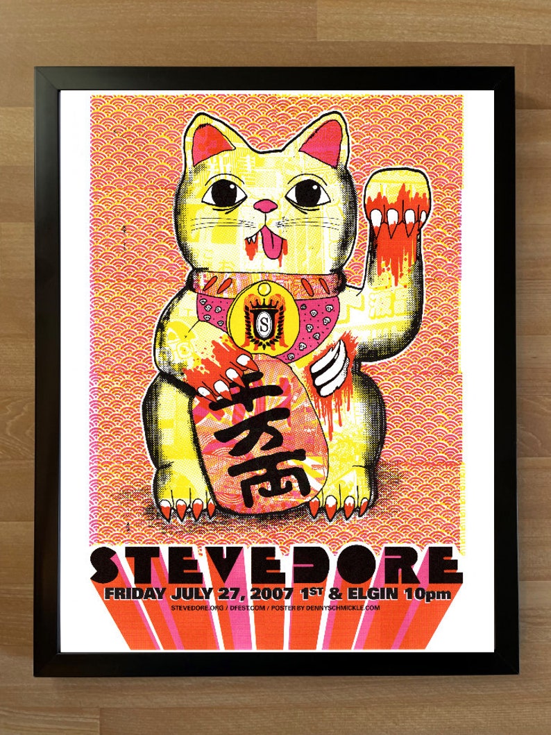 May include: A black and white poster with a yellow and red cartoon cat with a red tongue sticking out. The cat is holding a red and yellow object with Chinese characters. The poster has the text "STEVEDORE FRIDAY JULY 27, 2007 1ST & ELGIN 10pm STEVEDORE.ORG/DFESTOOM/POSTER BY DENNYSCHMICKLE.COM".