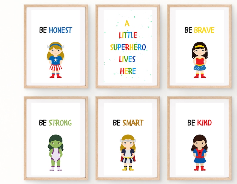 May include: Six framed art prints with inspirational messages and superhero illustrations. The prints feature phrases like "BE HONEST," "BE BRAVE," and "BE KIND." Each print has a white background with colorful text and cartoon superhero characters.