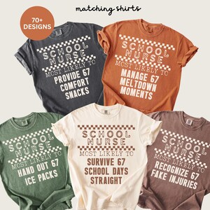 May include: A collection of five Comfort Colors t-shirts with the text "SCHOOL NURSE" and various phrases. The shirts are in different colors, including gray, orange, green, cream, and brown. Each shirt has a unique phrase related to a school nurse's duties.