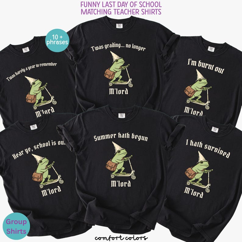 May include: Black Comfort Colors t-shirts with various phrases for teachers, including "Twas grading... no longer" and "Summer hath begun." Each shirt features a cartoon frog riding a scooter, wearing a dunce cap and carrying a satchel. Text at the bottom reads "M'lord."