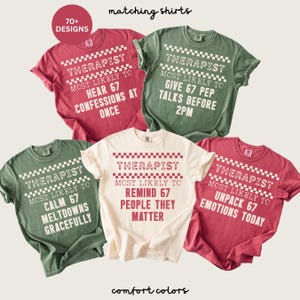 May include: A collection of five Comfort Colors t-shirts in various colors, each featuring the word "THERAPIST" and a humorous phrase. The shirts are in shades of red, green, and cream, with white text. The image also includes the text "matching shirts" and "70+ DESIGNS."