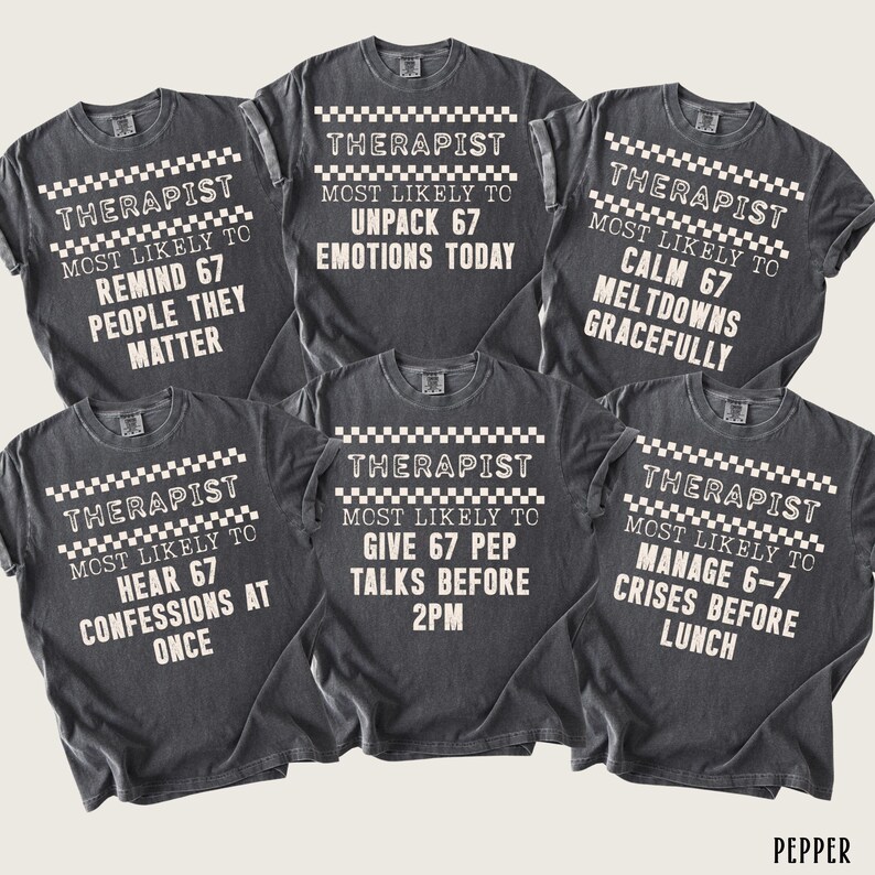 May include: Six dark gray t-shirts with white text and a checkered pattern. Each shirt reads "Therapist Most Likely To" followed by a different humorous statement about a therapist's daily tasks. The shirts are displayed on a neutral background.