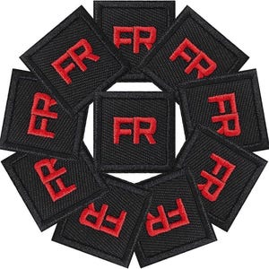 May include: Ten black fabric patches with red embroidered letters spelling "FR" on each patch.