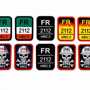 Puede incluir: Un conjunto de diez parches rectangulares. Algunos parches presentan el texto "FR", "2112" y "HRC 2" en varias combinaciones de colores, incluyendo verde, negro y rojo. Otros parches muestran una calavera con un casco con el texto "FR", "2112" y "HRC 2".