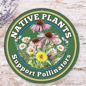May include: A green round sign with the text "NATIVE PLANTS Support Pollinators" in white lettering. The sign features a colorful illustration of various flowers, including purple coneflowers, white daisies, and yellow dandelions.