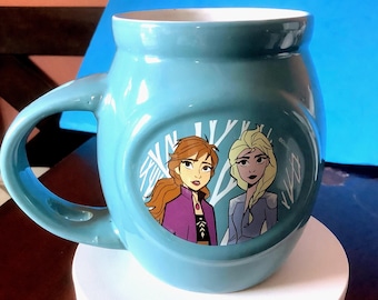 Disney Mug, Frozen sisters, light blue, place for spoon, 8 ounces from Frankford Candy, made in 2019. No issues except missing spoon.