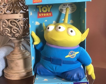 Toy Story Talking Alien Plush, 13” tall, original voice, plastic head & hands. 1 owner, never used or removed from box, takes 2 AA batteries