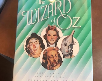 Wizard of Oz official 50th anniversary pictorial history table book, 11.75” x 8.5”, book cover worn.