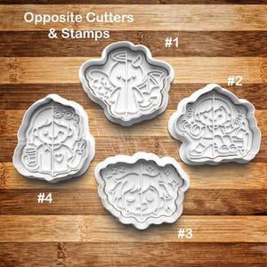 May include: Four white plastic cookie cutters and stamps with different designs. The designs include an angel/devil, a person with a radio, a sleeping person, and a person with glasses and a peace sign. The text "Opposite Cutters & Stamps" is at the top.