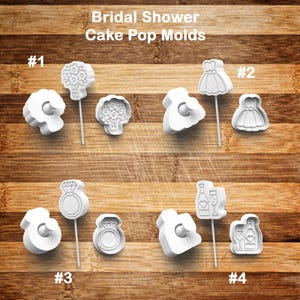 May include: White plastic cake pop molds for a bridal shower, featuring designs of a bouquet, wedding dress, engagement ring, and champagne glasses with a bottle. The text "Bridal Shower Cake Pop Molds" is at the top.