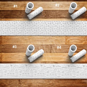 May include: White rolling pins with textured patterns and matching hollow handles are displayed above patterned strips. One strip features food-related icons, and the other displays mathematical formulas and geometric shapes. The items are arranged on a wooden surface.