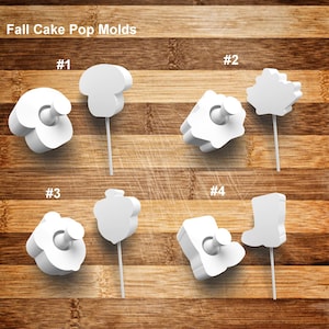 May include: White fall-themed cake pop molds in various shapes, including a mushroom, leaf, acorn, and boot. Each mold is attached to a white stick and labeled with a number. The text "Fall Cake Pop Molds" is at the top.