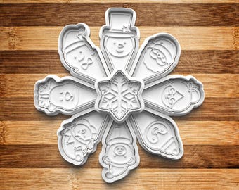 May include: A set of nine white plastic cookie cutters shaped like a snowflake and eight different Christmas characters. The cutters are arranged in a circle on a wooden surface.