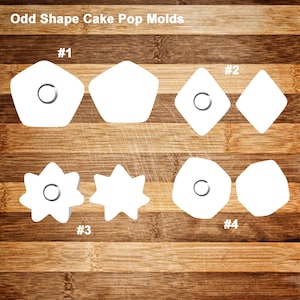 May include: White, odd-shaped cake pop molds. The molds are in various shapes, including a pentagon, diamond, star, and a rounded shape. Each mold has a circular indentation. The text "Odd Shape Cake Pop Molds" is at the top.