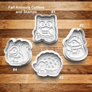 May include: White plastic cookie cutters and stamps in the shapes of fall animals, including an owl, fox, hedgehog, and squirrel. The text "Fall Animals Cutters and Stamps" is at the top. The cutters are numbered 1 through 4.