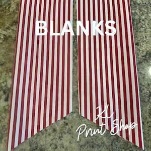 May include: Two fabric panels with a red and white striped pattern. The word "BLANKS" is printed in large white letters across the top. The text "KL Print Shop" is written in cursive at the bottom.