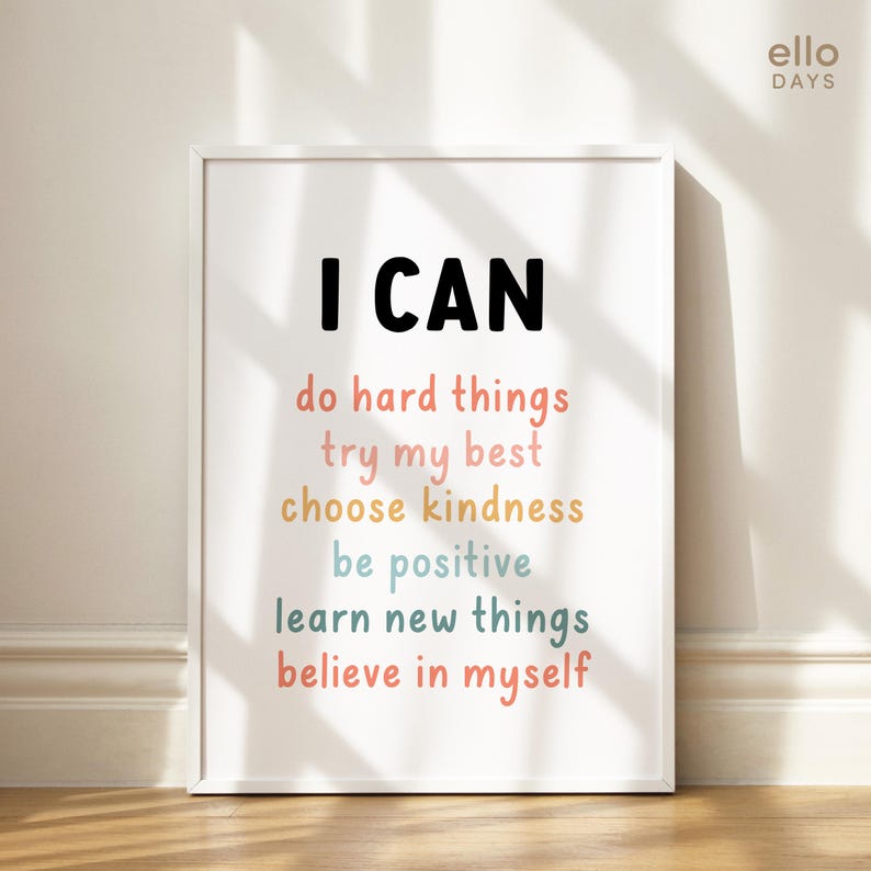 May include: A white framed print with the text "I CAN" in black, followed by a list of positive affirmations in colourful text: "do hard things", "try my best", "choose kindness", "be positive", "learn new things", and "believe in myself".