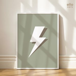 May include: A white lightning bolt graphic on a sage green background in a white frame. The text "ello DAYS" is in the top right corner of the image.