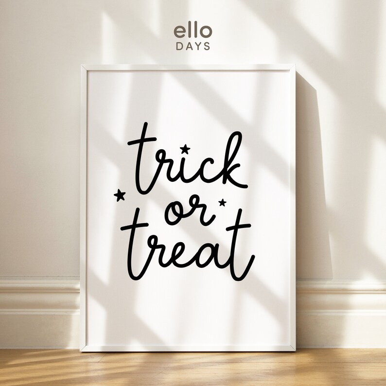 May include: White framed print with the text "trick or treat" in black cursive font with two small stars on either side of the word "or".