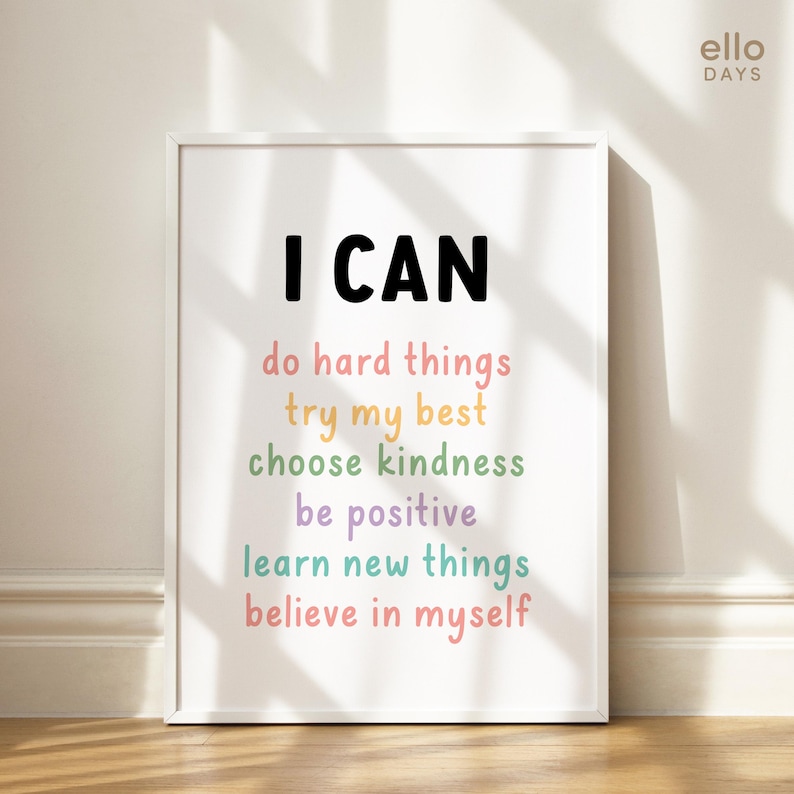 May include: White framed print with the text "I CAN" in black, followed by a list of positive affirmations in colourful text: "do hard things", "try my best", "choose kindness", "be positive", "learn new things", and "believe in myself".