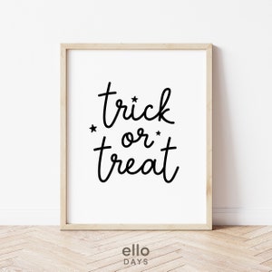 May include: A black and white printable wall art print with the text "trick or treat" in a handwritten font. Two small stars are on either side of the word "or".
