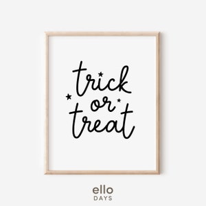 May include: A black and white printable art print with the text "trick or treat" in a handwritten font. The text is surrounded by two small stars.